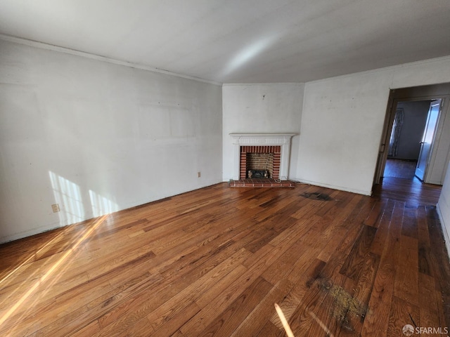 unfurnished living room featuring hardwood / wood-style flooring and a fireplace