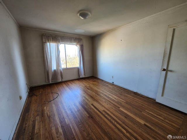 spare room featuring dark hardwood / wood-style flooring