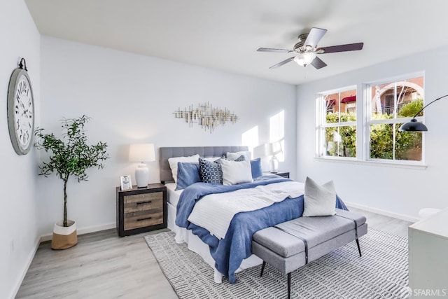 bedroom featuring light hardwood / wood-style floors and ceiling fan