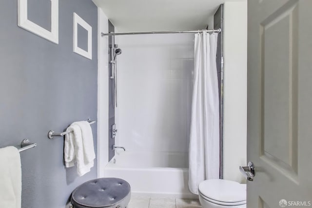 bathroom with tile patterned flooring, toilet, and shower / tub combo with curtain