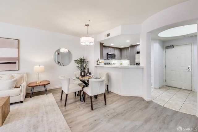 dining room with light wood-type flooring