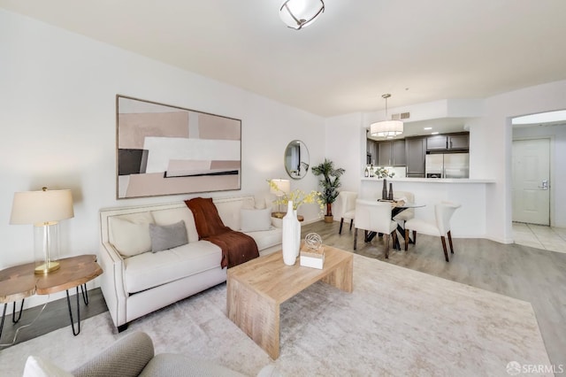 living room with light hardwood / wood-style floors