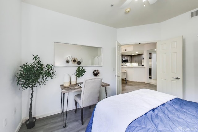 bedroom featuring dark wood-type flooring and ceiling fan