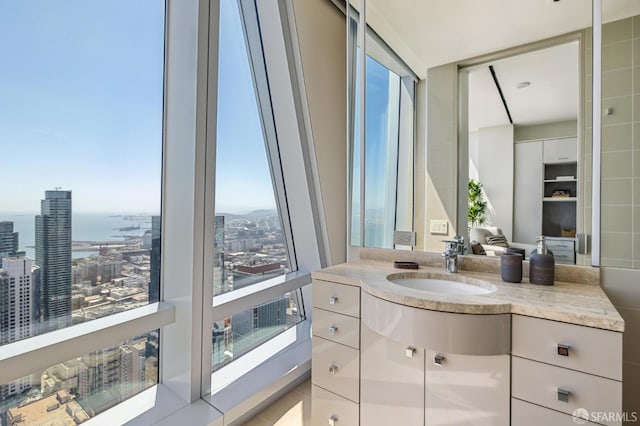 bathroom with vanity and a water view