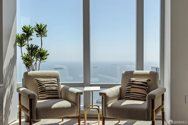 sitting room featuring a water view