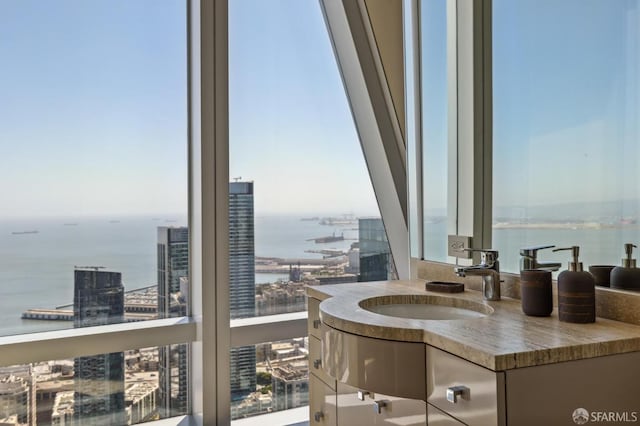 bathroom with a water view and vanity