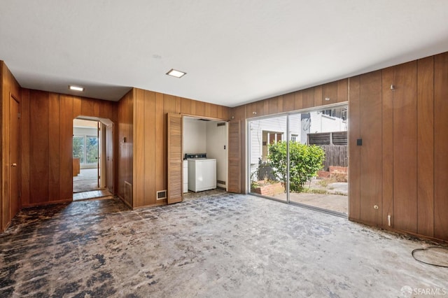 37 San Jacinto Way, San Francisco, CA 94127 - unfurnished living room featuring washer / dryer, wood walls, and arched walkways