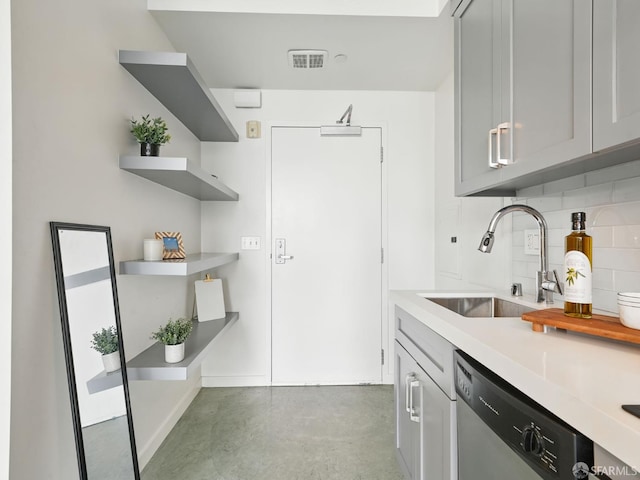 766 Harrison St Unit 711, San Francisco, CA 94107 - kitchen with dishwasher, backsplash, finished concrete flooring, light countertops, and open shelves