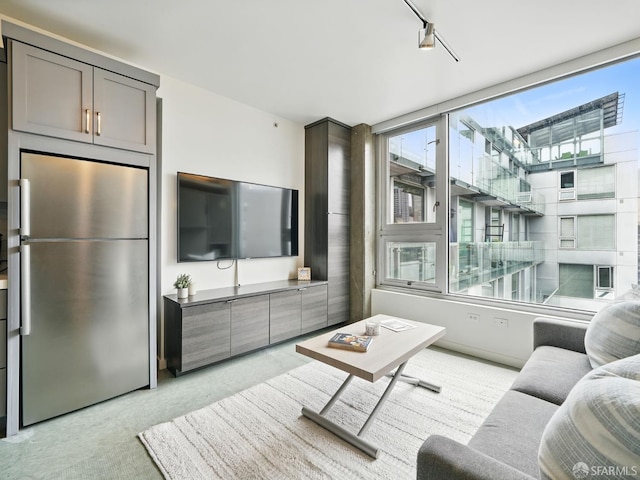 766 Harrison St Unit 711, San Francisco, CA 94107 - living room featuring healthy amount of natural light and light colored carpet