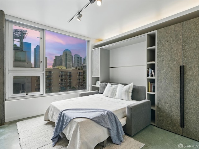 766 Harrison St Unit 711, San Francisco, CA 94107 - bedroom featuring concrete flooring and a skyline view