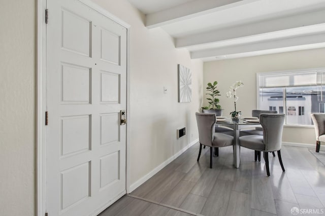 dining room with beam ceiling