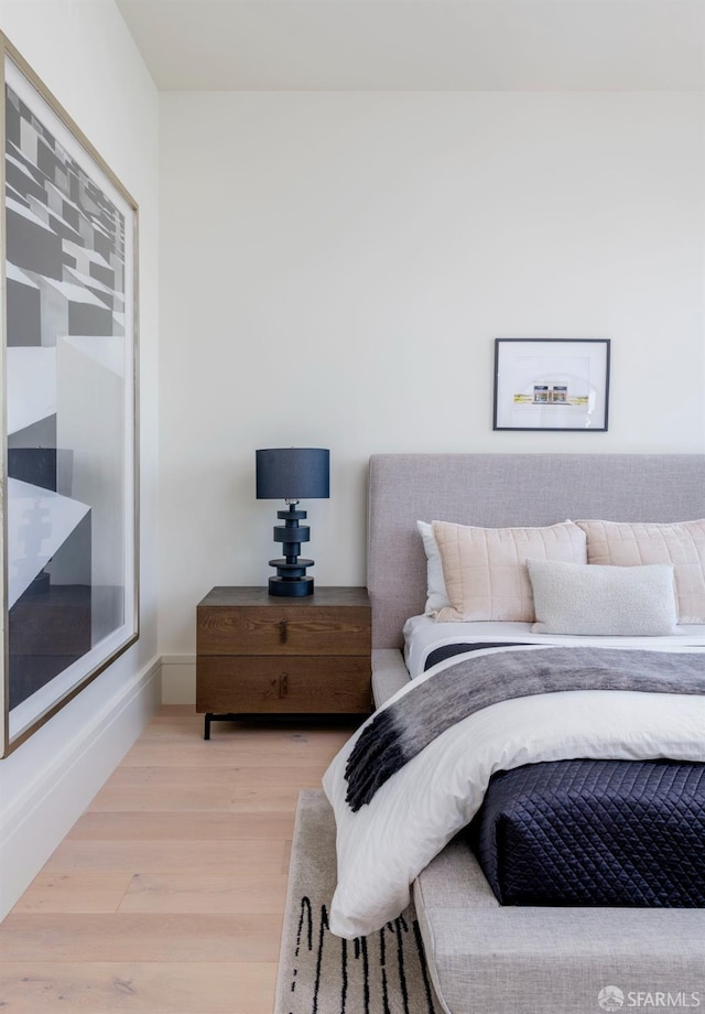 bedroom with wood finished floors