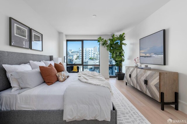 bedroom with light wood-style floors