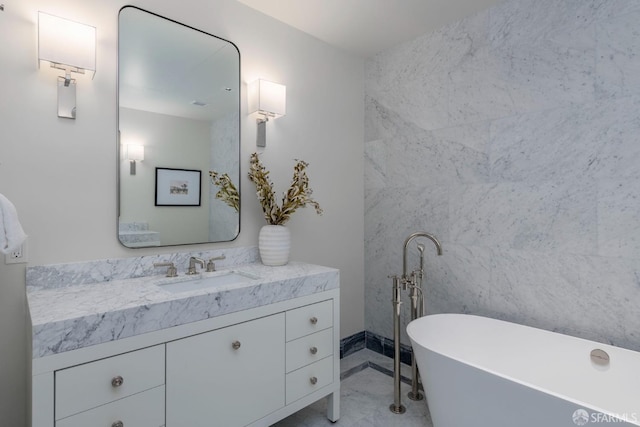 full bathroom with a soaking tub and vanity