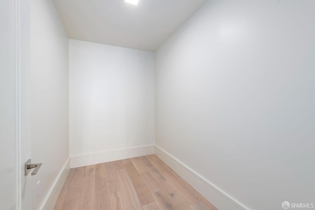 unfurnished room featuring light wood-style floors and baseboards