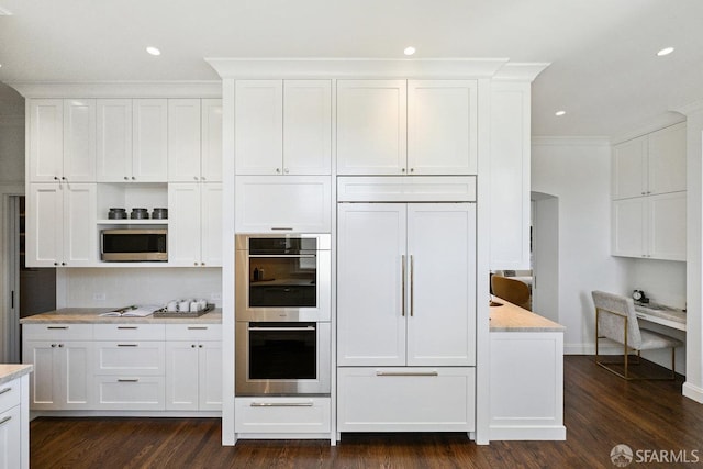 2500 Steiner St Unit 3, San Francisco, CA 94115 - kitchen featuring stainless steel appliances, white cabinetry, dark wood-style floors, crown molding, and backsplash