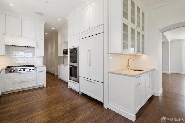 kitchen featuring white cabinetry, dark wood-type flooring, and ornamental molding