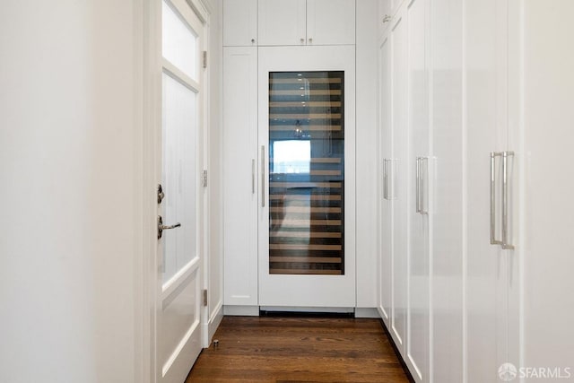 hall with dark wood-type flooring