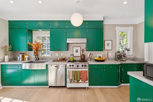 kitchen featuring plenty of natural light, appliances with stainless steel finishes, extractor fan, and a sink