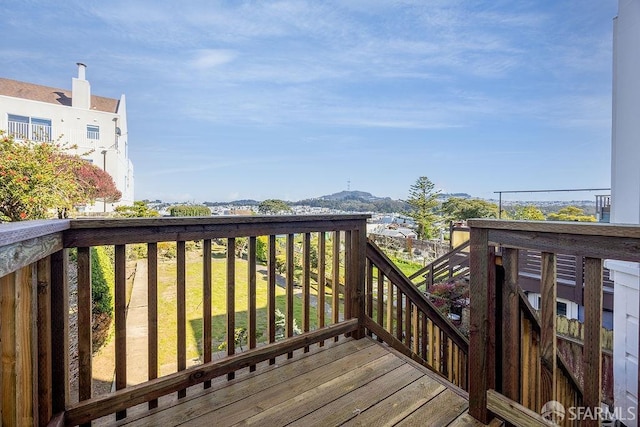 wooden terrace featuring a mountain view