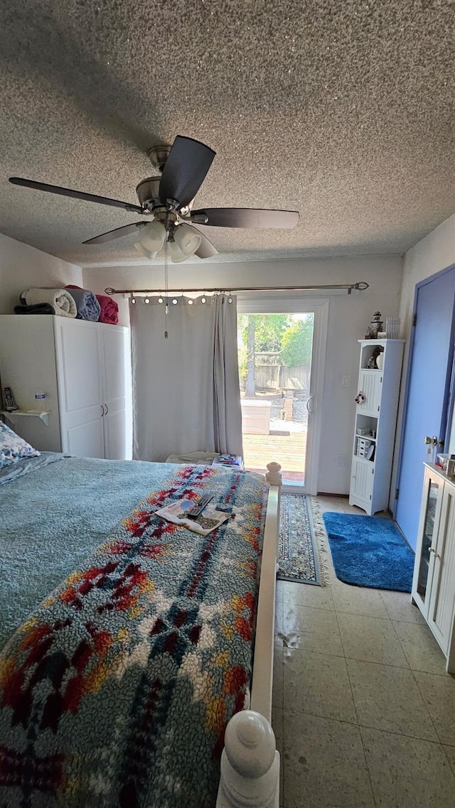 bedroom with light floors, a ceiling fan, access to outside, and a textured ceiling