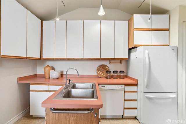 kitchen featuring a sink, white cabinetry, and white appliances