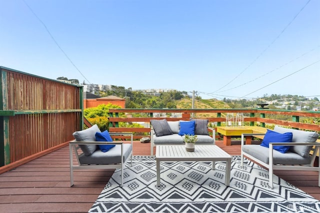 wooden deck with an outdoor living space