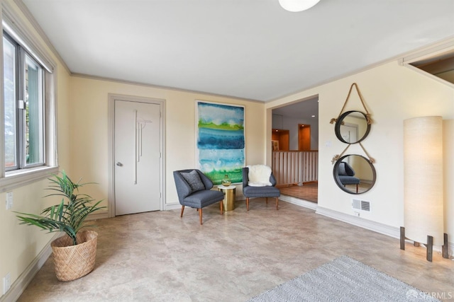 sitting room featuring visible vents and baseboards