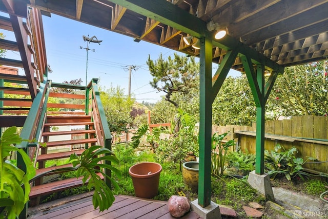 exterior space featuring fence and stairway