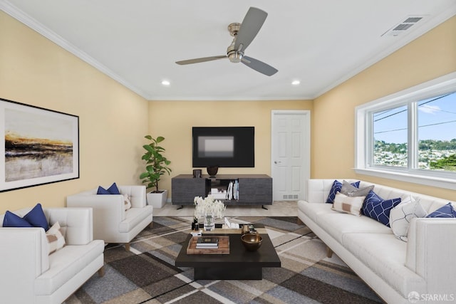 living room featuring crown molding and ceiling fan