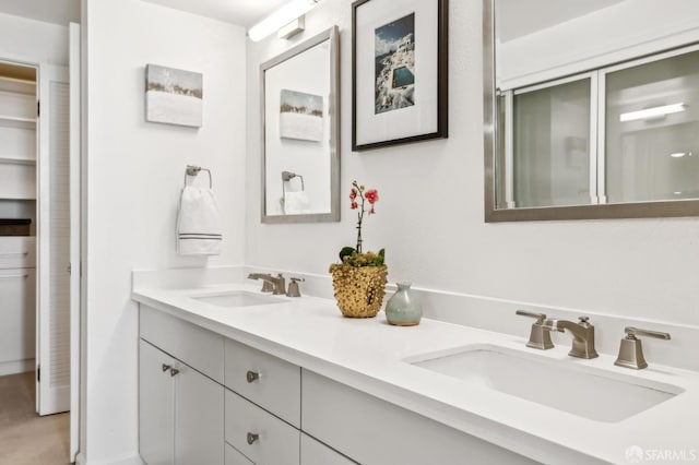 bathroom with double vanity and a sink