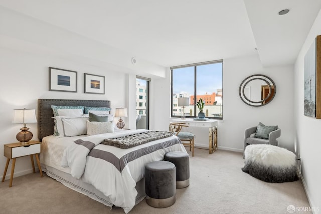 carpeted bedroom with baseboards