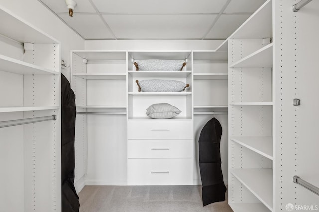 walk in closet with a drop ceiling