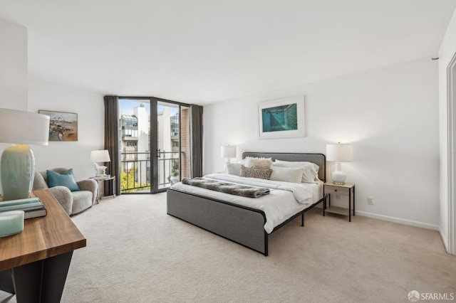 bedroom with baseboards, carpet, access to exterior, and floor to ceiling windows