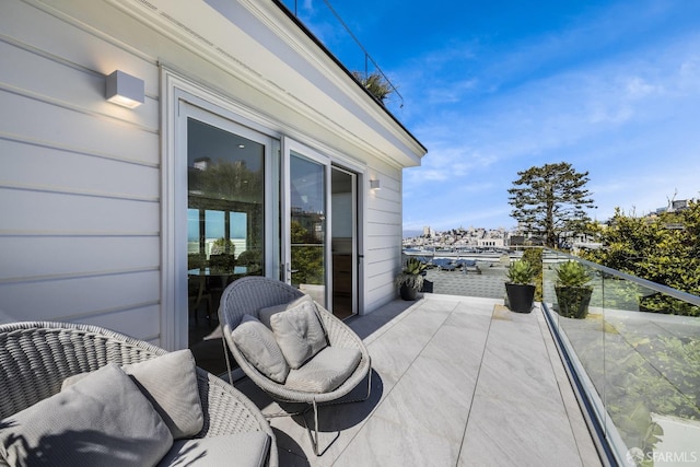 view of patio featuring a balcony