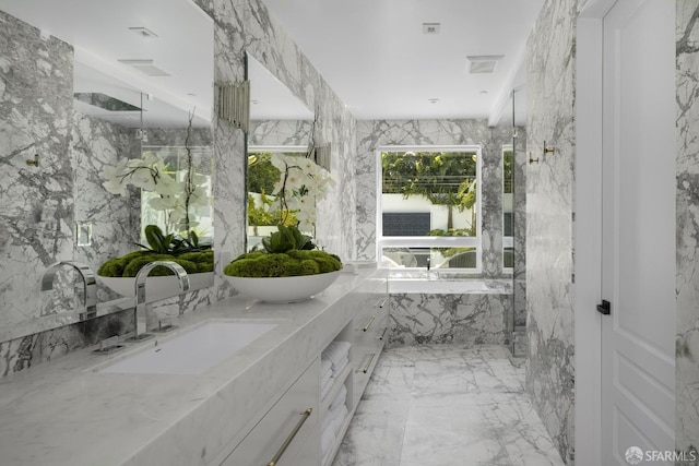 bathroom with walk in shower and vanity