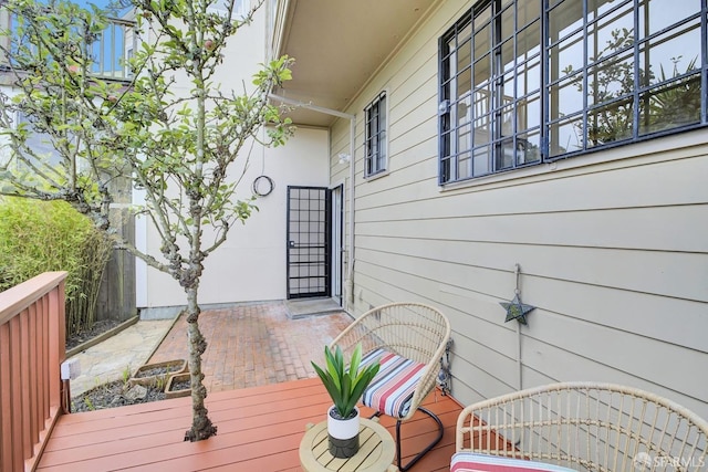 wooden terrace featuring a patio