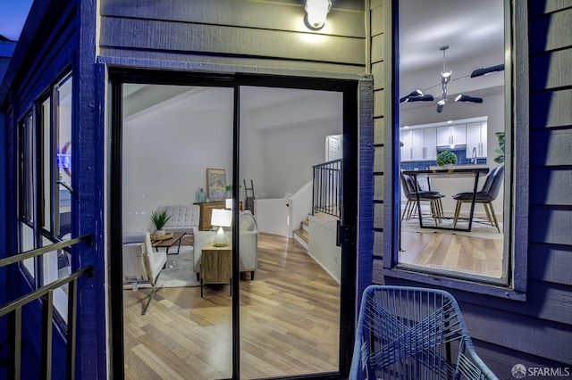 details with sink and hardwood / wood-style flooring