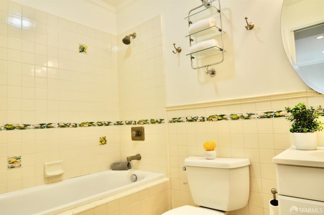 full bathroom featuring vanity, tile walls, toilet, and crown molding