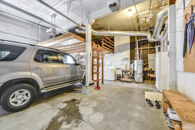 garage featuring water heater and a sink
