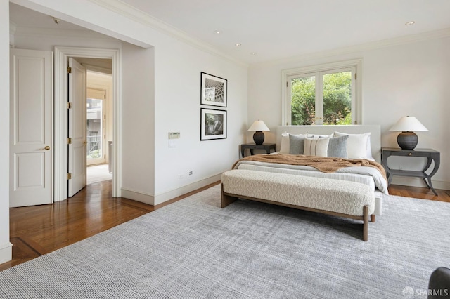 bedroom with crown molding and dark hardwood / wood-style flooring