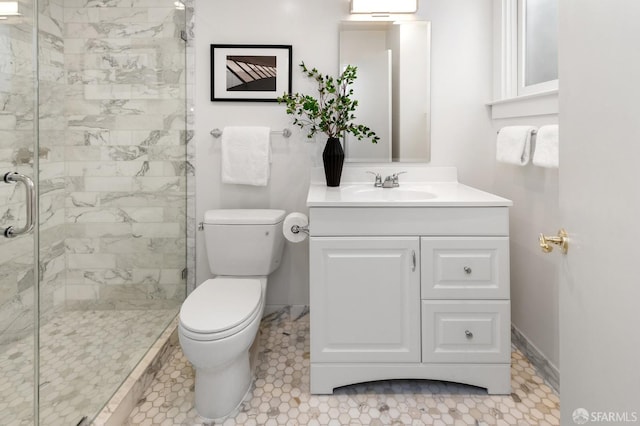 bathroom featuring tile patterned flooring, a shower with shower door, vanity, and toilet