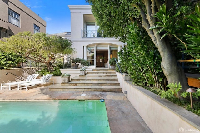 view of swimming pool with a patio area