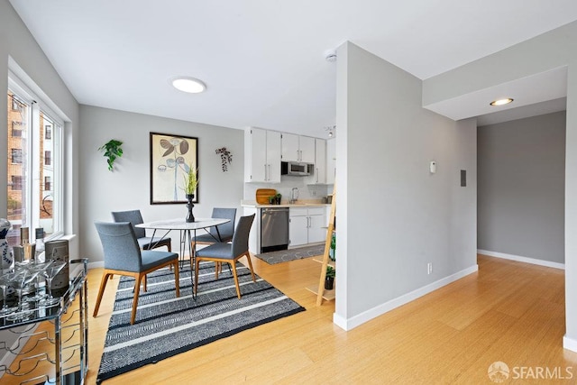 3421 25th St Unit 4, San Francisco, CA 94110 - dining area featuring light wood finished floors and baseboards