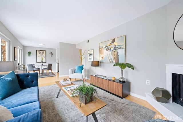 3421 25th St Unit 4, San Francisco, CA 94110 - living area featuring light wood-type flooring and baseboards