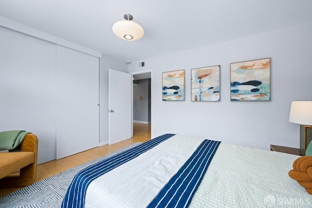 3421 25th St Unit 4, San Francisco, CA 94110 - bedroom with wood finished floors and a closet