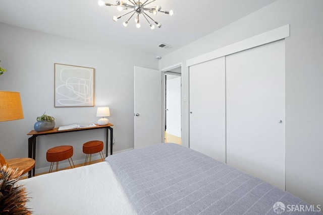 3421 25th St Unit 4, San Francisco, CA 94110 - bedroom featuring a chandelier, a closet, and baseboards