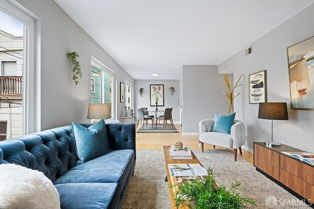 3421 25th St Unit 4, San Francisco, CA 94110 - living room with light wood-type flooring and baseboards