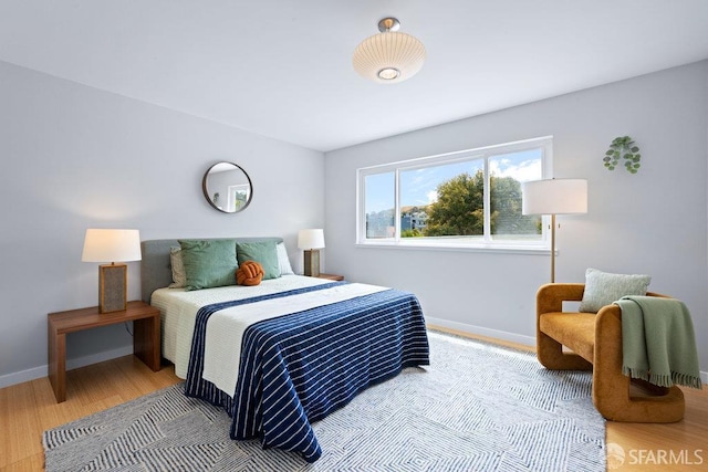 3421 25th St Unit 4, San Francisco, CA 94110 - bedroom featuring baseboards and wood finished floors
