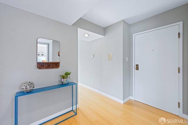 3421 25th St Unit 4, San Francisco, CA 94110 - hallway with wood finished floors, baseboards, and recessed lighting